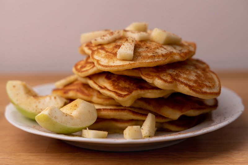 Pancakes topped with apples and cinnamon