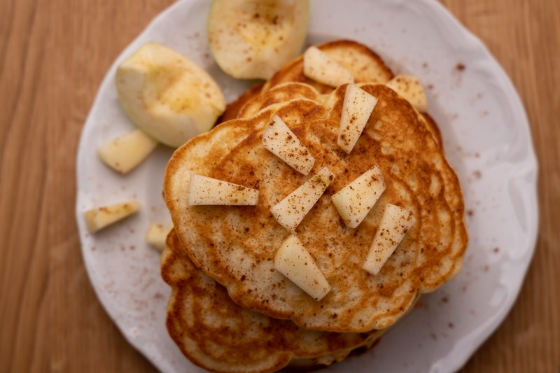 Pancakes topped with apple slices