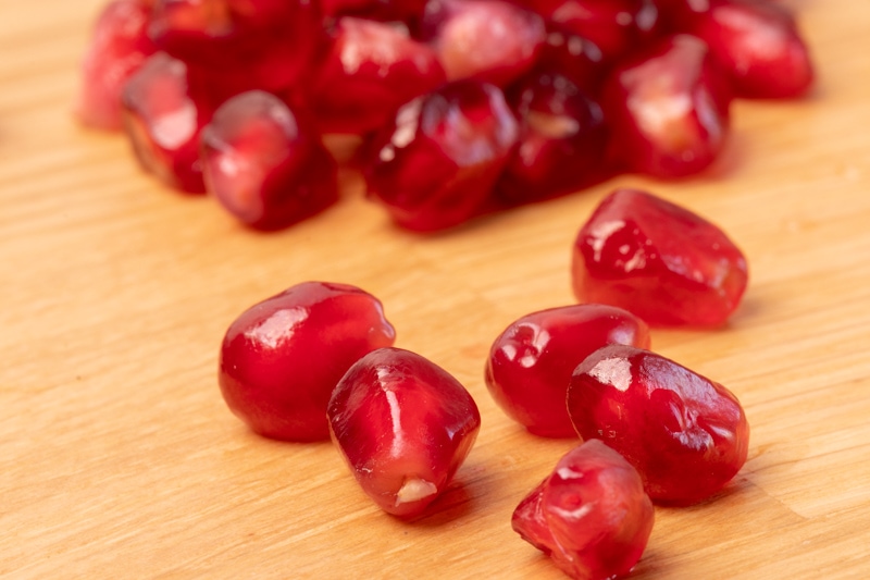 Pomegranate seeds on a table
