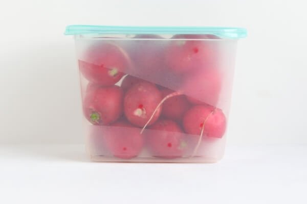 Radishes in airtight container
