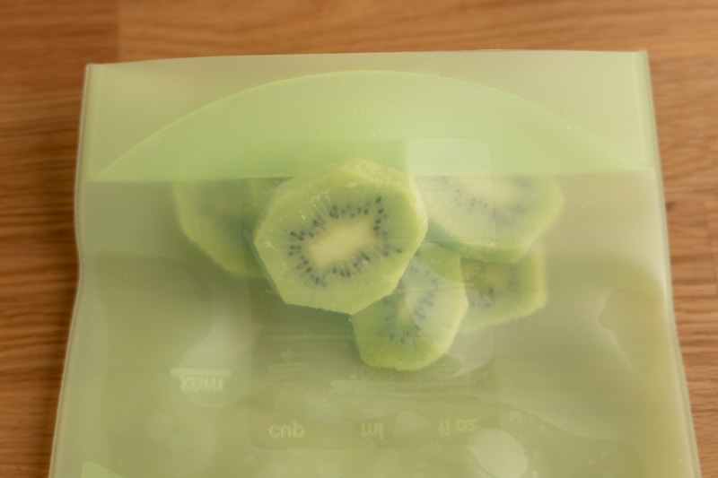 Frozen kiwi slices in a freezer bag