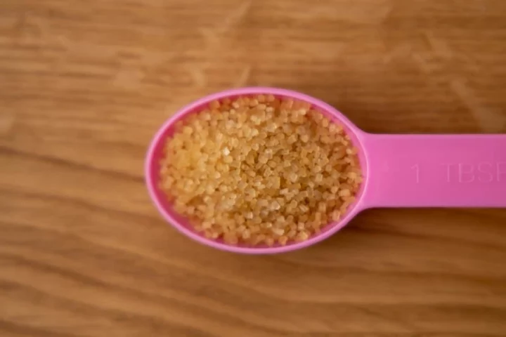 Brown sugar in a measuring spoon
