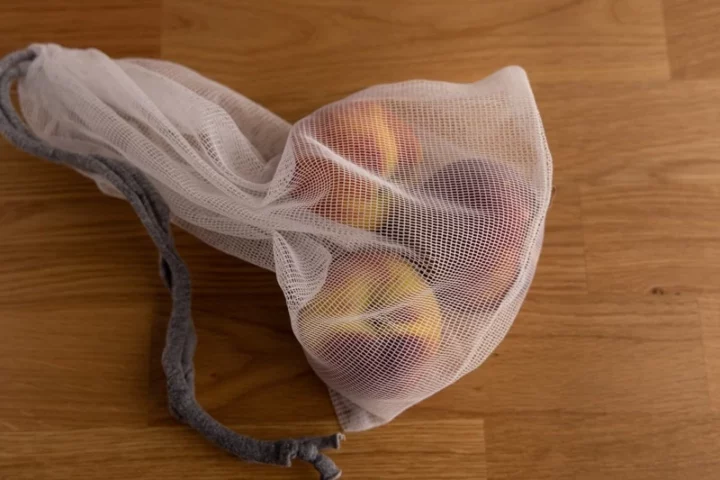Peaches in ventilated bag