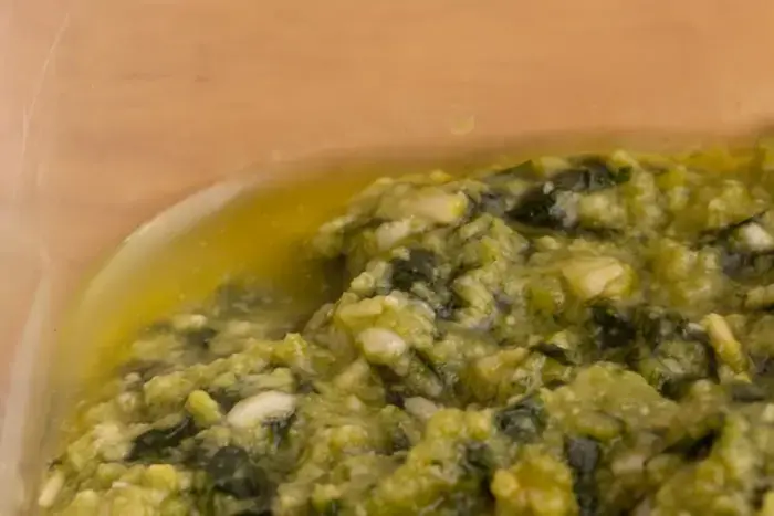 olive oil separated into pesto