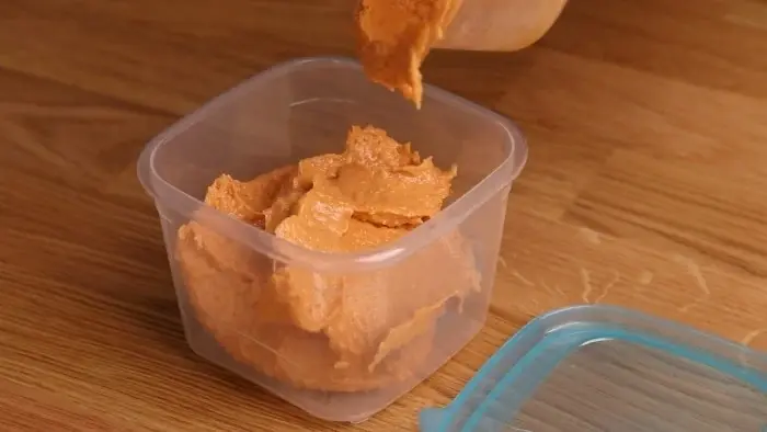 pour the hummus into container 1
